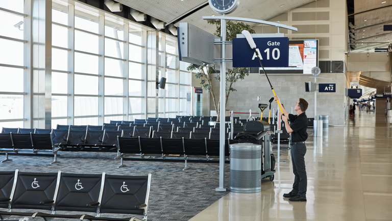 Man cleaning airport terminal