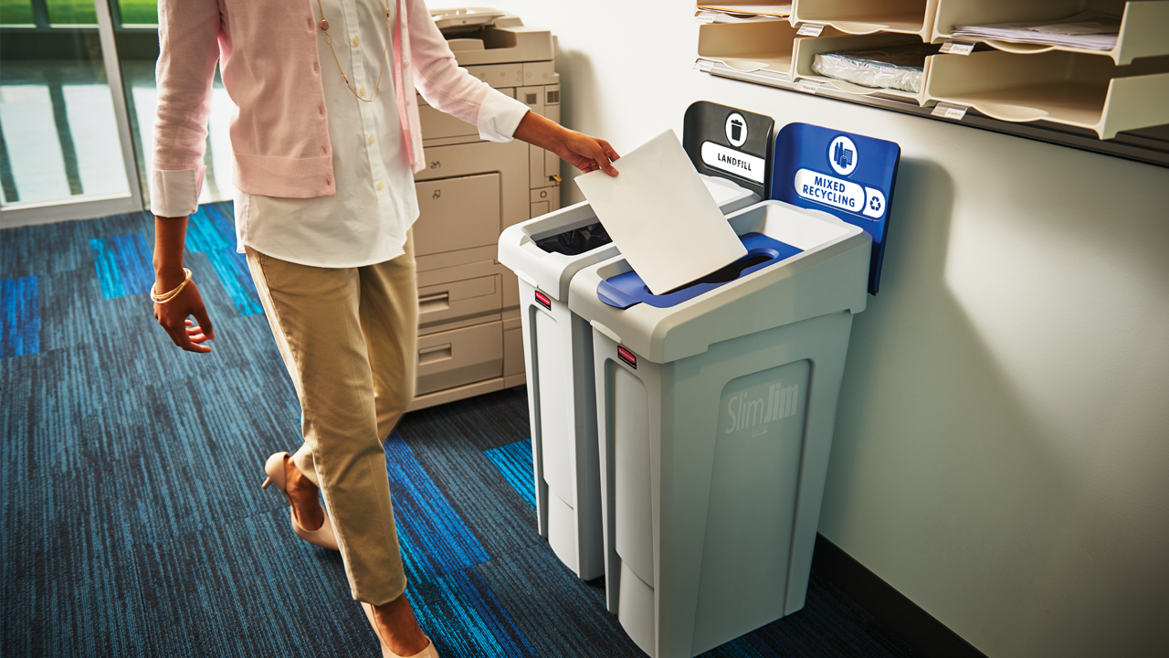 Woman Throwing Paper to Rubbermaid Commercial Products Waste Bin