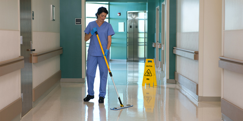 Nurse in hospital with launderable mop