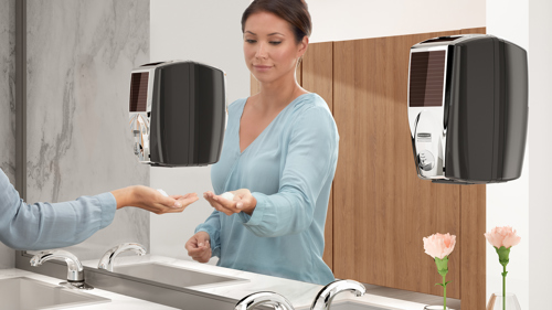 person using Rubbermaid soap dispenser