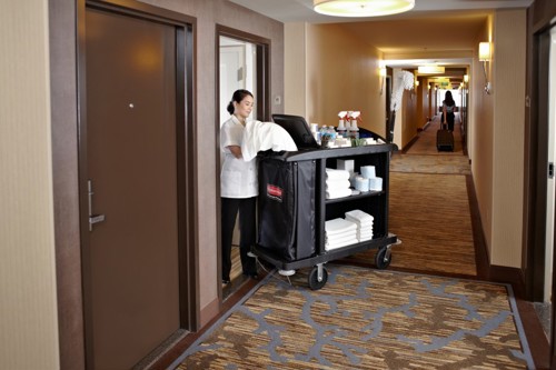 A staff using Rubbermaid cart