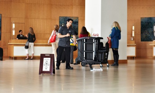 Hotel staff cleaning floor using Rubbermaid Microfibre mops