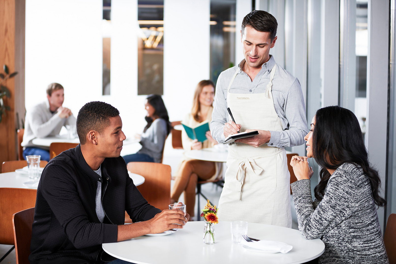 Waiter taking an order