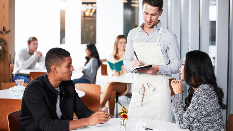 Waiter taking an order