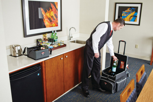 Hotel staff using Rubbermaid Cart