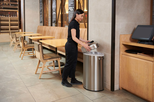 Hotel syaff cleaning the bins