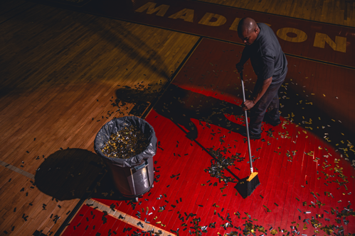 Man cleaning with a broom